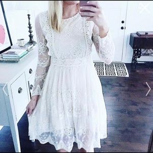 Ivory dress with beautiful lace detailing.